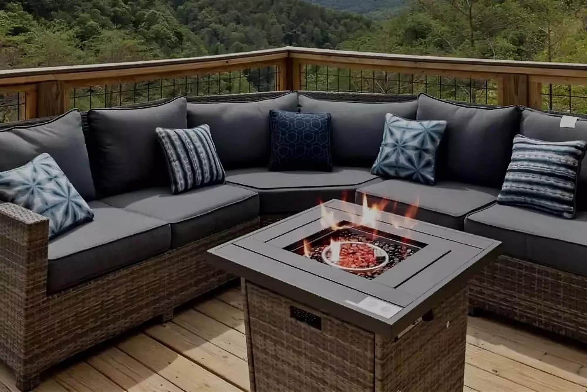 fire pit on deck of cabin with mountain view