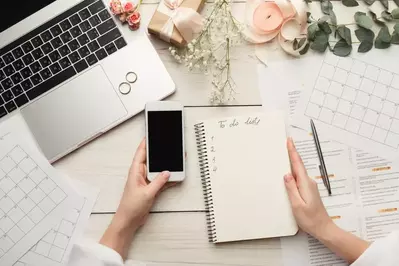 wedding planner's notepad, calendar, laptop, etc.