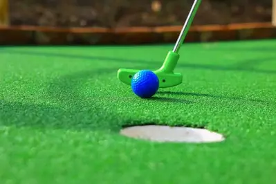 A,Club,Prepares,To,Hit,A,Ball,During,A,Mini