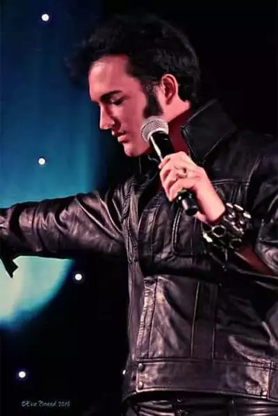 guy dressed like elvis black leather jacket