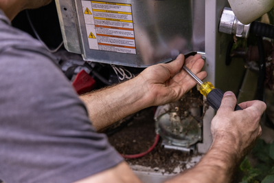 technician working on an HVAC unit
