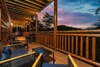 seating on a cabin deck at sunset