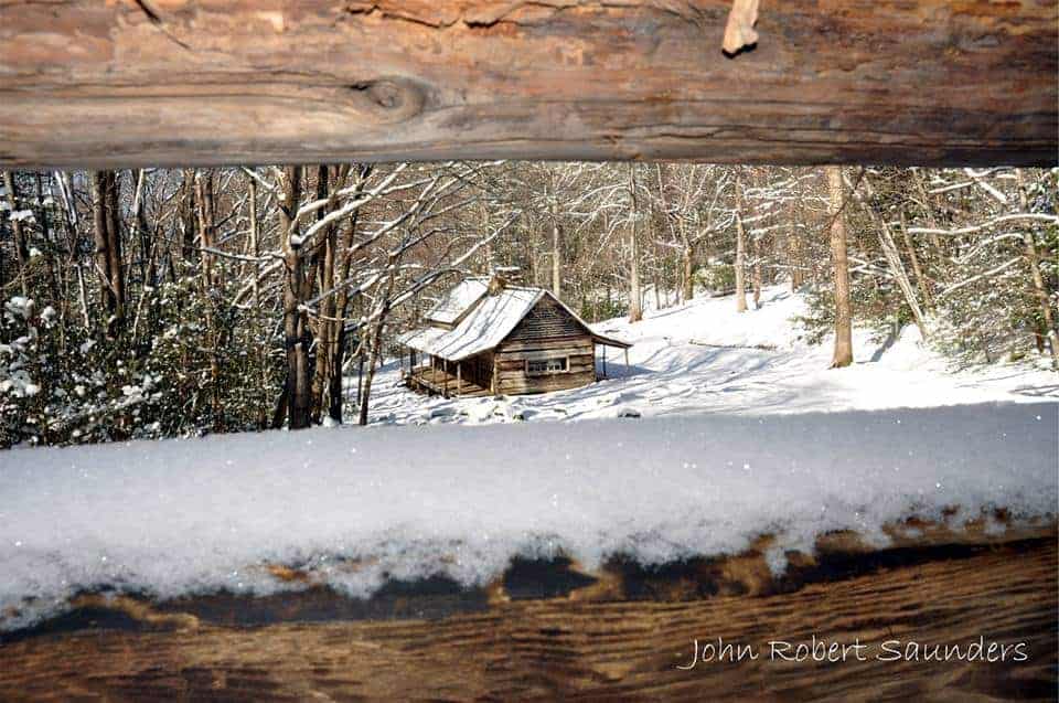 cabin in the winters covered in snow