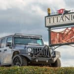 titanic museum sign and gray jeep