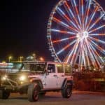 jeep in front of the wheel at the island at night
