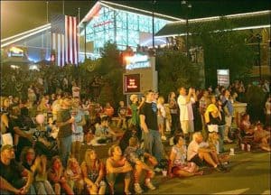 people in front of ripley's aquarium watching a parade