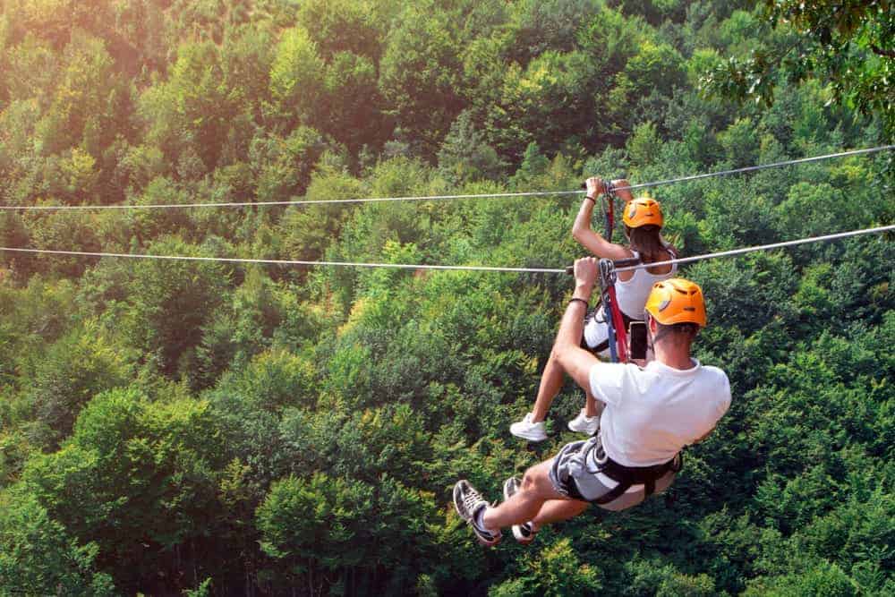 people ziplining in the smoky mountains