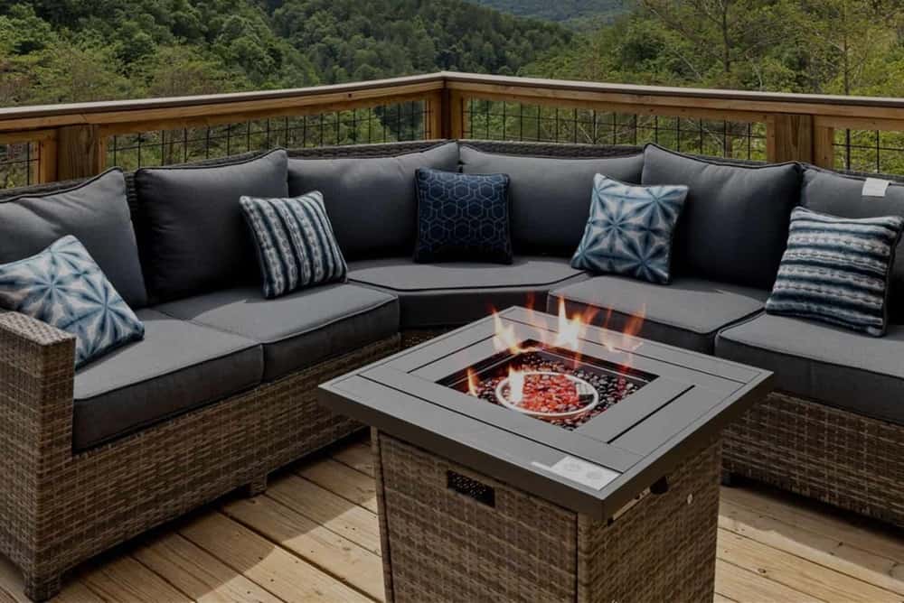 fire pit on deck of cabin with mountain view